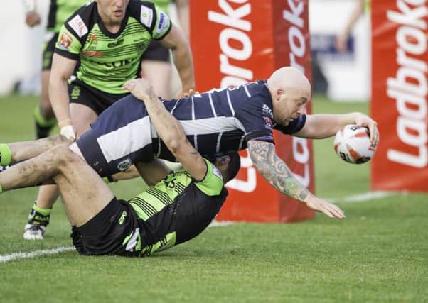 Featherstone's John Davies scores a try against Halifax.