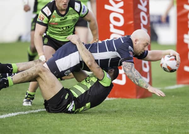 Featherstone's John Davies scores a try against Halifax.