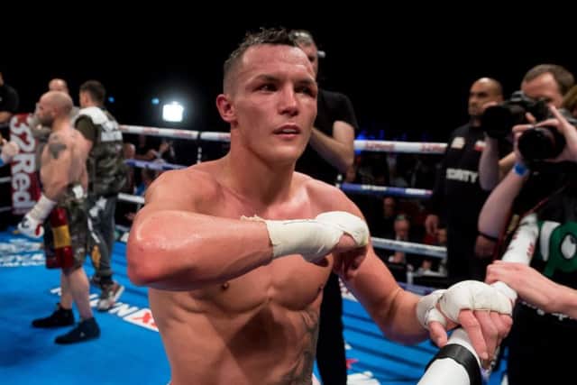 Josh Warrington celebrating his win at the First Direct Arena. Picture by James Hardisty.