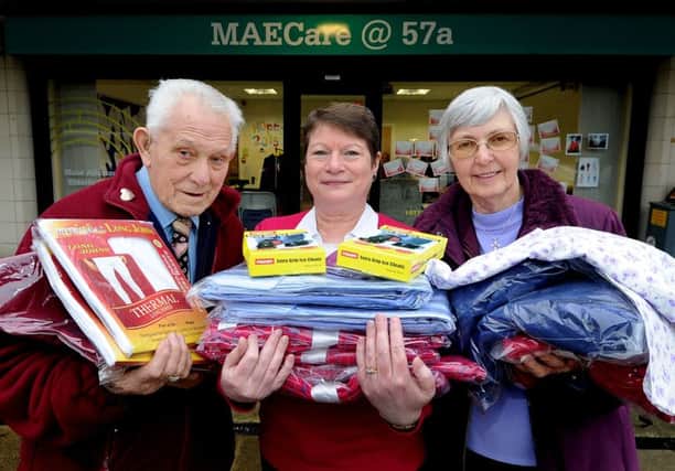 Help plea: Charity MAECare , pictured in 2015 selling clothes for a Know Your Neighbour campaign, are appealing for more volunteer drivers.