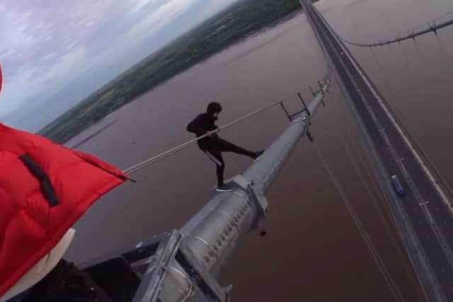 Thrill-seekers scaling the Humber Bridge
