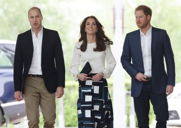 The Duke and Duchess of Cambridge and Prince Harry (right) arriving at the Queen Elizabeth Olympic Park in east London where they launched Heads Together - their new campaign to end mental health stigma. PA