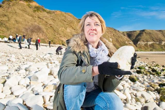 NATURAL CHOICE: Tracy Foster at Flamborough South Cliff with some of the 2,000 tonnes of pebbles that she has borrowed for the Welcome to Yorkshire Garden at the Chelsea Flower Show.