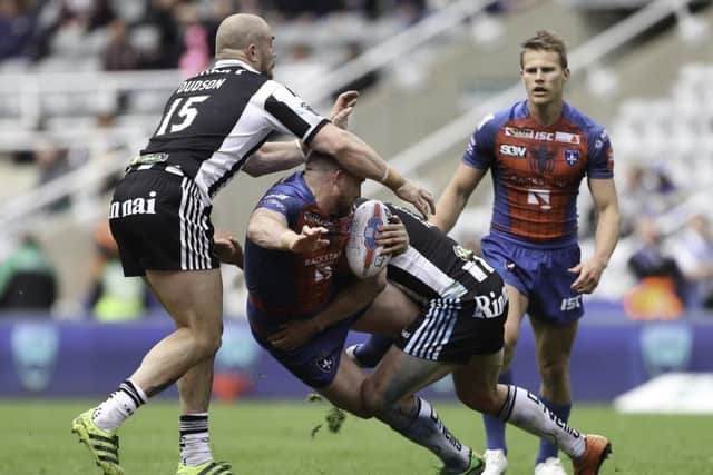 Wakefield's Danny Kirmond is tackled.
