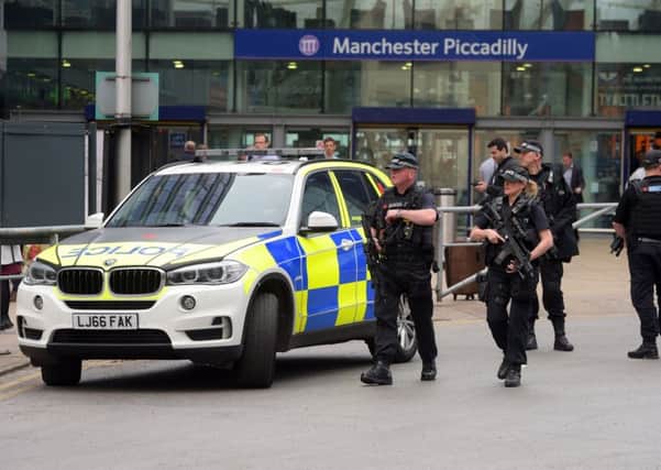 Armed police outside Manchester Piccadilly station. PIC: PA