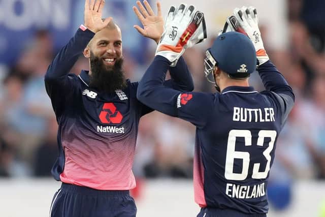 Englands Moeen Ali celebrates with Jos Buttler after taking the wicket of South Africas Chris Morris in their victory over South Africa at Headingley (Picture: Martin Rickett/PA).