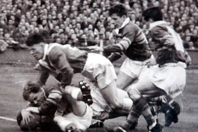 Don Robinson, scoring the winning try for Leeds against Barrow in the Challenge Cup Final. .