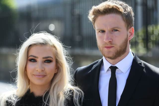 Model Laura Lacole and footballer Eunan O'Kane outside the High Court in Belfast. Pic: PA Wire