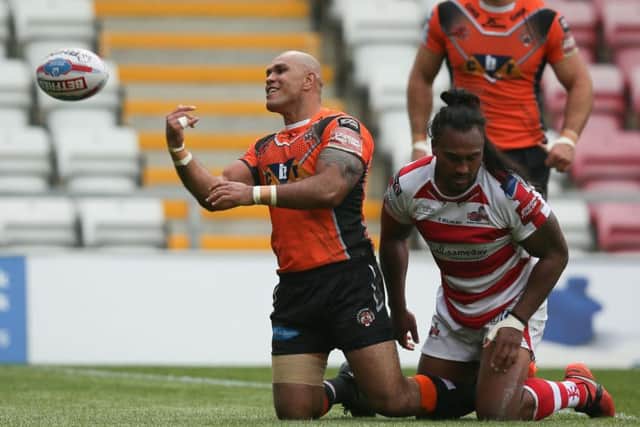 Jake Webster of Castleford Tigers celebrates scoring a try