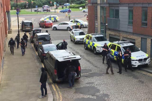 Armed police outside the block of flats in Kelham Island