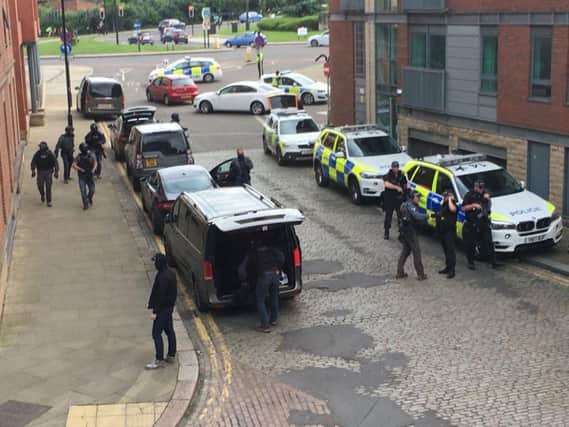 Armed police outside the block of flats in Kelham Island