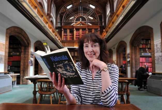 Rose Gibson, the manager of Leeds Central Library, with the donated copy of Finland's beloved book, Kalevala.  Picture by Tony Johnson.