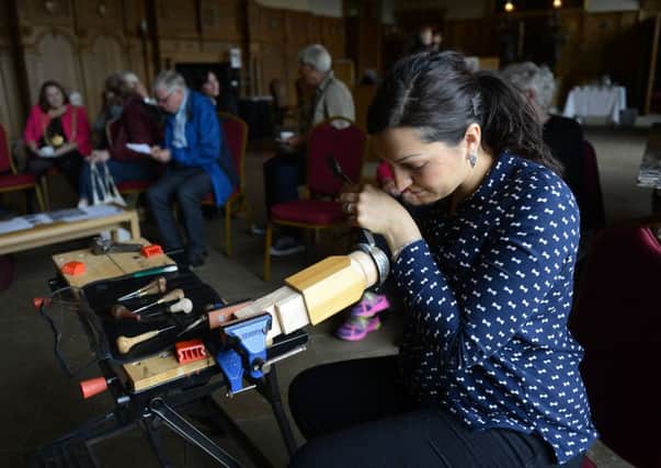 10 June 2017..... A live demonstration by artist Miriam Hanid on the art of silversmithing in the Great Hall at Temple Newsam in Leeds. Picture Scott Merrylees