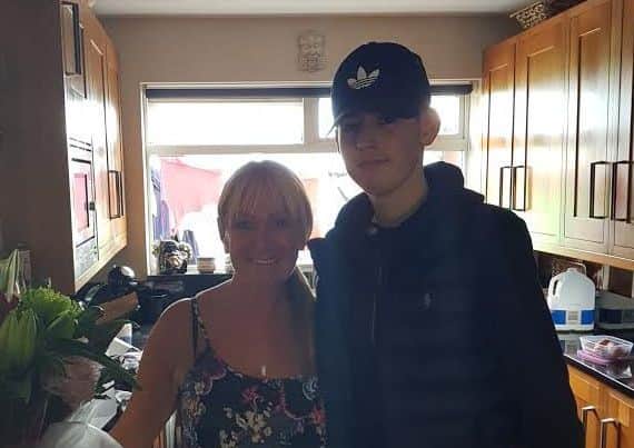 Connor Laws with East Leeds ARLFC's Janice Crawford, who helped organise a recent fundraiser for the teenager.