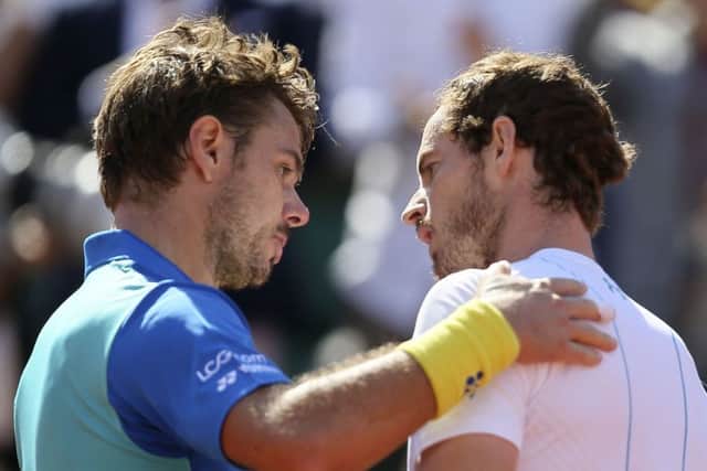 Stan Wawrinka, left, consoles Andy Murray after beating him in their French Open semi-final in paris on Friday afternoon. Picture: AP Photo/David Vincent