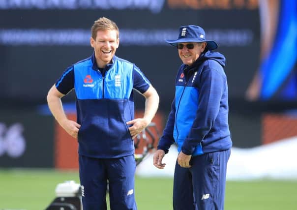 England captain Eoin Morgan speaks with coach Trevor Bayliss . Picture: Mike Egerton/PA