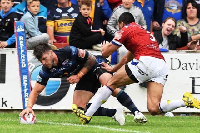Tom Briscoe touches down for Leeds Rhinos' third try.