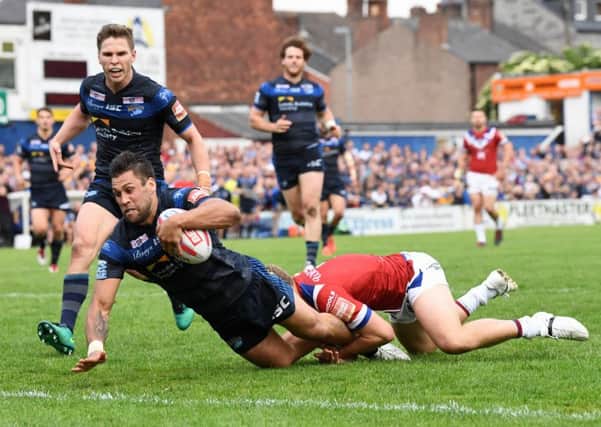 Joel Moon touches down for Leeds Rhinos against Wakefield Trinity.