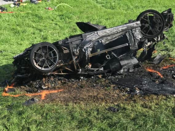 The shell of the burnt-out car after the dramatic crash