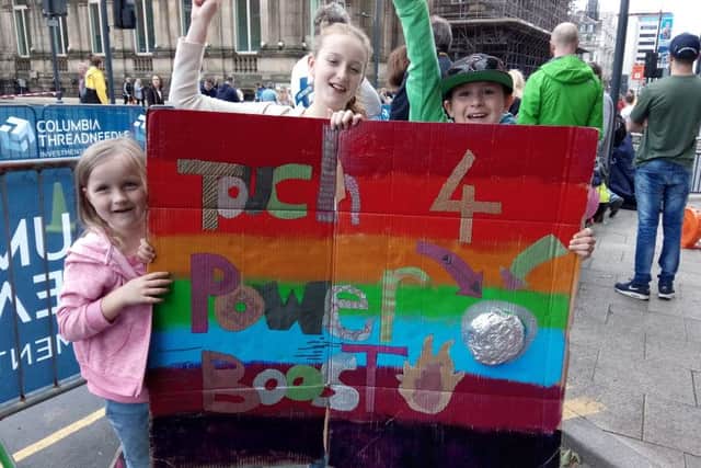 Evie Sorley, aged six, and siblings Milly, 12, and Ben, 10, from Beeston, offered unique support for the competitors, including their father, David.