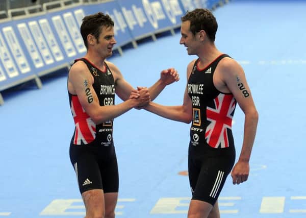 Jonny Brownlee congratulates his brother, Alistair, on winning the Elite Men's Race. PIC: Tony Johnson