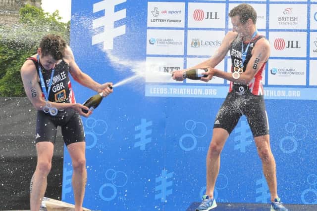 Alistair and Jonny Brownlee spray the champagne after their World Series one-two in Leeds. PIC: Tony Johnson