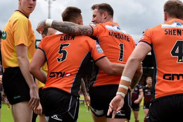 Full-back Zak Hardaker congratulates five-try Greg Eden. PIC: Matthew Merric/rlphotos.com