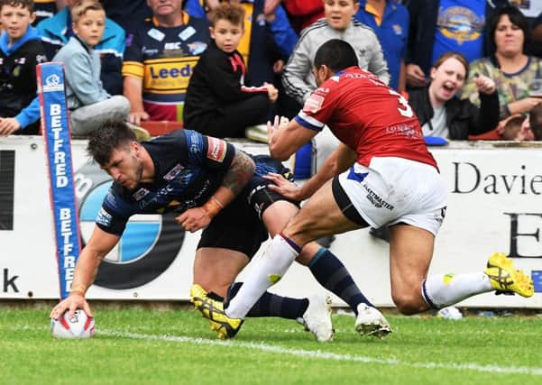 Tom Briscoe touches down for the Rhinos' third try at Wakefield Trinity. PIC: Bruce Rollinson