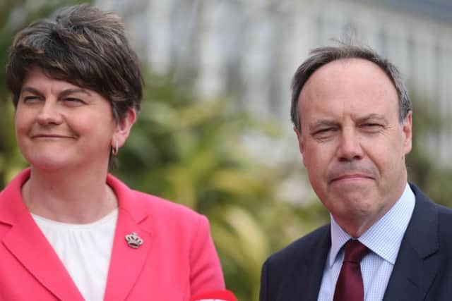 DUP leader Arlene Foster and Nigel Dodds speak to the media at Stormont Castle in Belfast ahead of talks aimed at restoring powersharing in Northern Ireland.  Picture: Niall Carson/PA Wire
