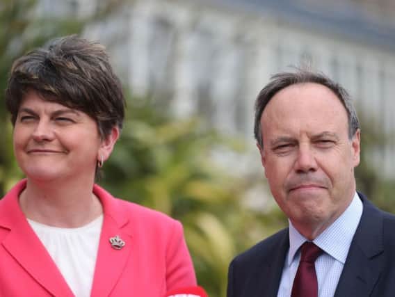 DUP leader Arlene Foster and Nigel Dodds speak to the media at Stormont Castle in Belfast ahead of talks aimed at restoring powersharing in Northern Ireland.  Picture: Niall Carson/PA Wire