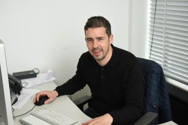 Dr Ben Hughes in his office at Sheffield Arts Tower