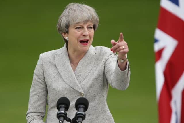 Prime Minister Theresa May speaks at a joint press conference with French President Emmanuel Macron at the Elysee Palace during her visit to Paris, France. PIC: PA