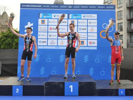 Jonny Brownlee stands on second on the podium at Leeds after brother Alistair won the race