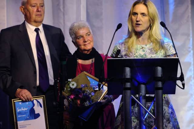 Kim Leadbeater and her parents accept the Yorkshire Rose given posthumously to Jo Cox at this years Women of Achievement Awards. Picture: Jonathan Gawthorpe