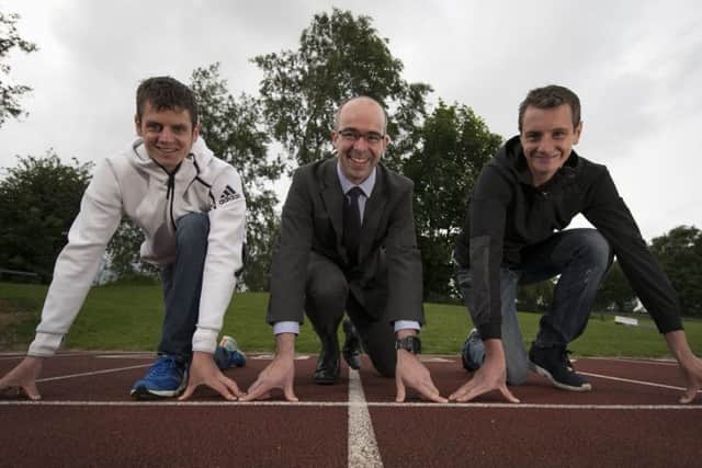 Jonny and Alistair Brownlee with Simon Usher Persimmon Homes Yorkshire managing director.