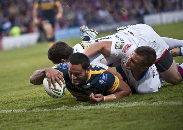 Wakefield's Richie Mathers and Kyle Trout cannot prevent Weller Hauraki from scoring for Leeds Rhinos.