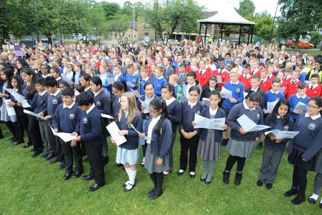 Schools gather in Green Park, Heckmondwike to perform songs in memory of Jo Cox. Jo parents and sister attending the event.