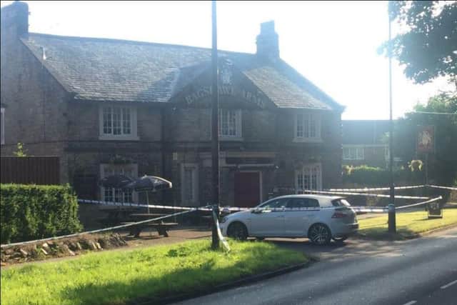 Police officers outside the Bagshaw Arms in Sheffield