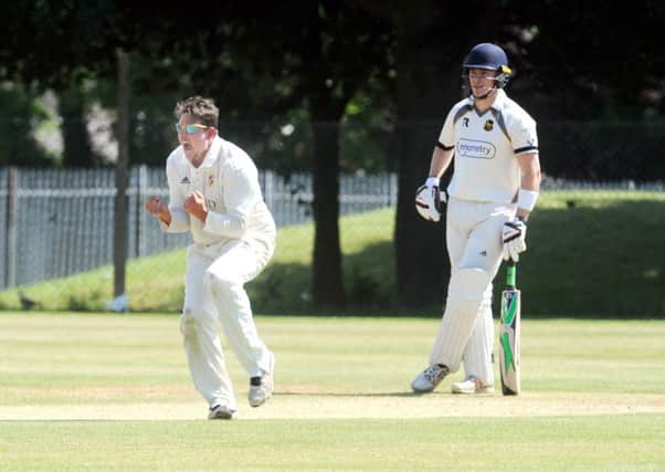 Jack Hughes, of Townville, celebrates getting the wicket of Pudsey St Larence batter Charlie Best LBW. PIC: Steve Riding