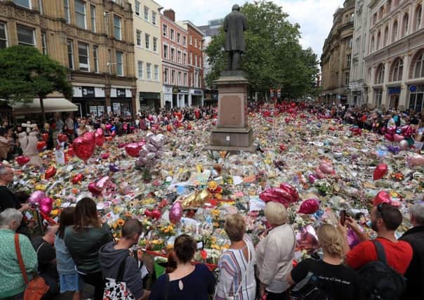 Flowers and tributes left in St Ann's Square in Manchester following the Manchester Arena terror attack. PIC: PA