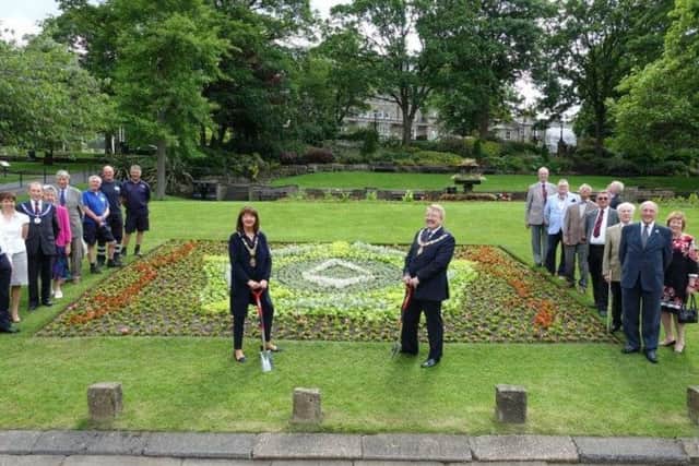 The Mayor of Harrogate Coun Anne Jones and the Provincial Grand Master of The Province of Yorkshire West Riding, David S Pratt, are watched by Harrogate Freemasons council employees as the pair perform the honours. Picture: Different PR
