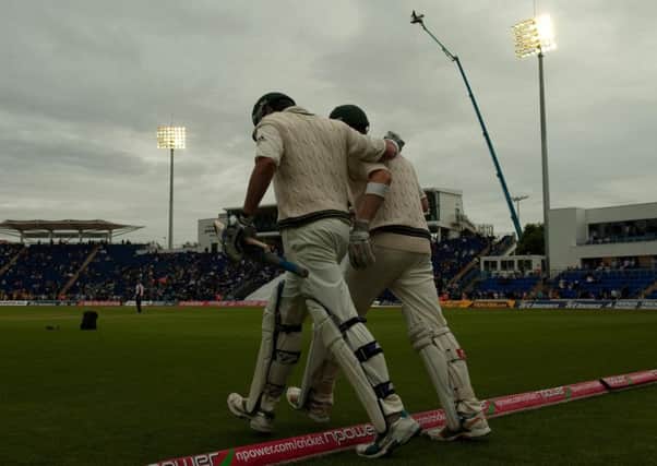 Lighting up: England and Australia walk out to play under floodlights for the first time in a Test on these shores at Sophia Gardens, Cardiff in 2009.