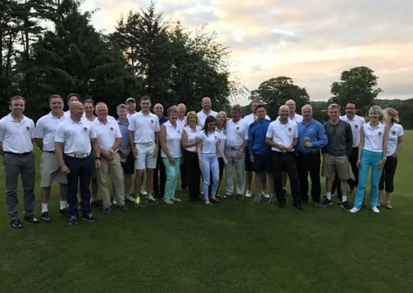 Players gather for a group photograph ahead of Headingleys marathon golfing day, which saw 25 players play five rounds.