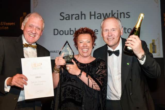 YEP backed People's Choice Award winner Sarah Hawkins is presented with her trophy and a bottle of bubbly by Leeds Hotels and Venues Association 2017 host Harry Gration and YEP's Commercial Content Editor Graham Walker.