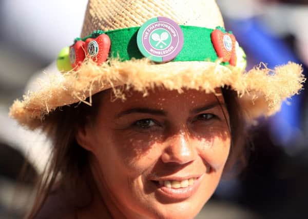 Spectator Joanne Price sports Wimbledon-themed hat on day three. PIC: PA