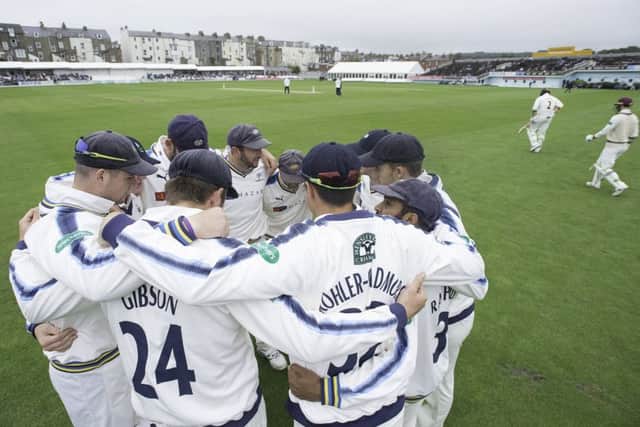 Yorkshire's team huddle as Somerset's opening batsman come out for the start of their second innings at Scarborough.