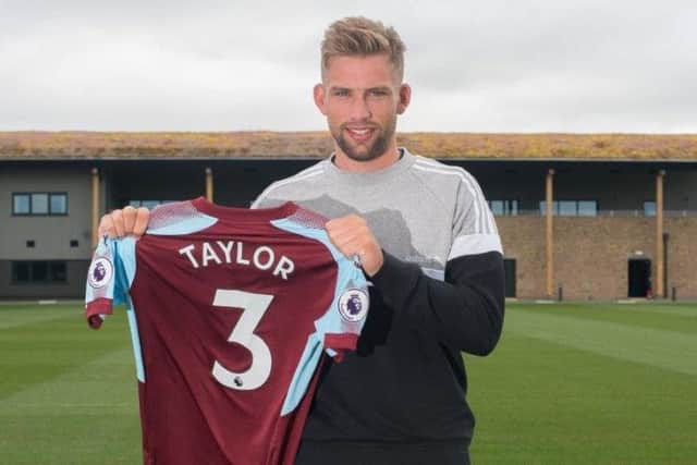 Charlie Taylor shows off his Burnley shirt.