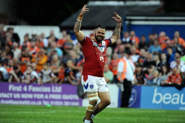 Wakefield's David Fifita celebrates his try with the crowd.