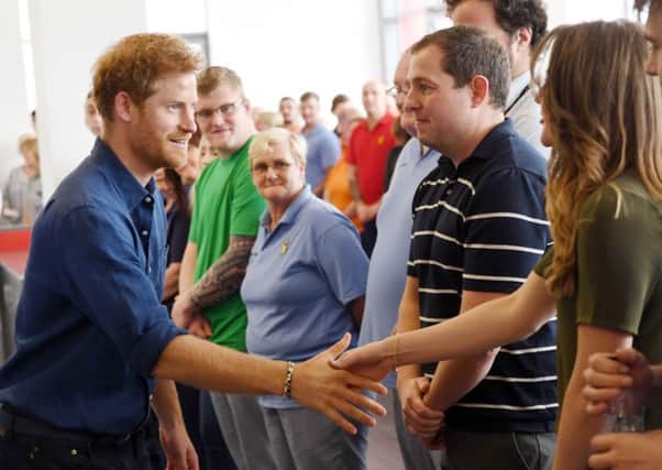 Prince Harry meets employees at the Haribo sweet factory. PIC: PA