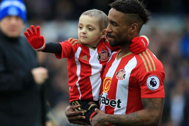 Bradley Lowery with Jermain Defoe. PIC: PA